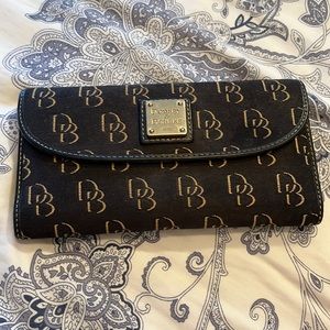 Well loved Dooney & Bourke wallet. Used for years and still good quality.